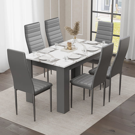 elegant marble dining table and 6 chairs set in grey and white with black leather chairs, modern vibe