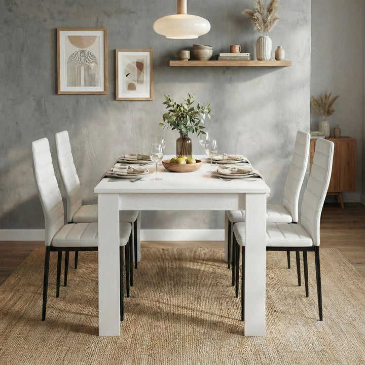[4 Seater | White] White 4-6 Seater Dining Table and Chairs Set front perspective of a modern kitchen layout with table decorations, grey plaster wall texture, and framed