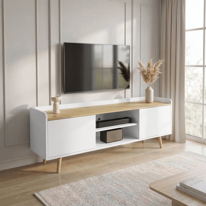 [White] White Larvik TV cabinet against panelled wall, mounted TV above and pampas vase on oak top beside window