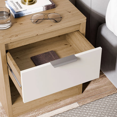Skova 4 Piece Bedroom Furniture Set bedside table with open drawer in oak and white finish, showing storage space and modern handle design.