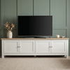 [White] Oskara TV unit 180cm lifestyle hero shot with large TV on top, green accent wall background