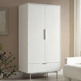 White double door wardrobe cabinet with vertical panel detailing and slim silver metal handles