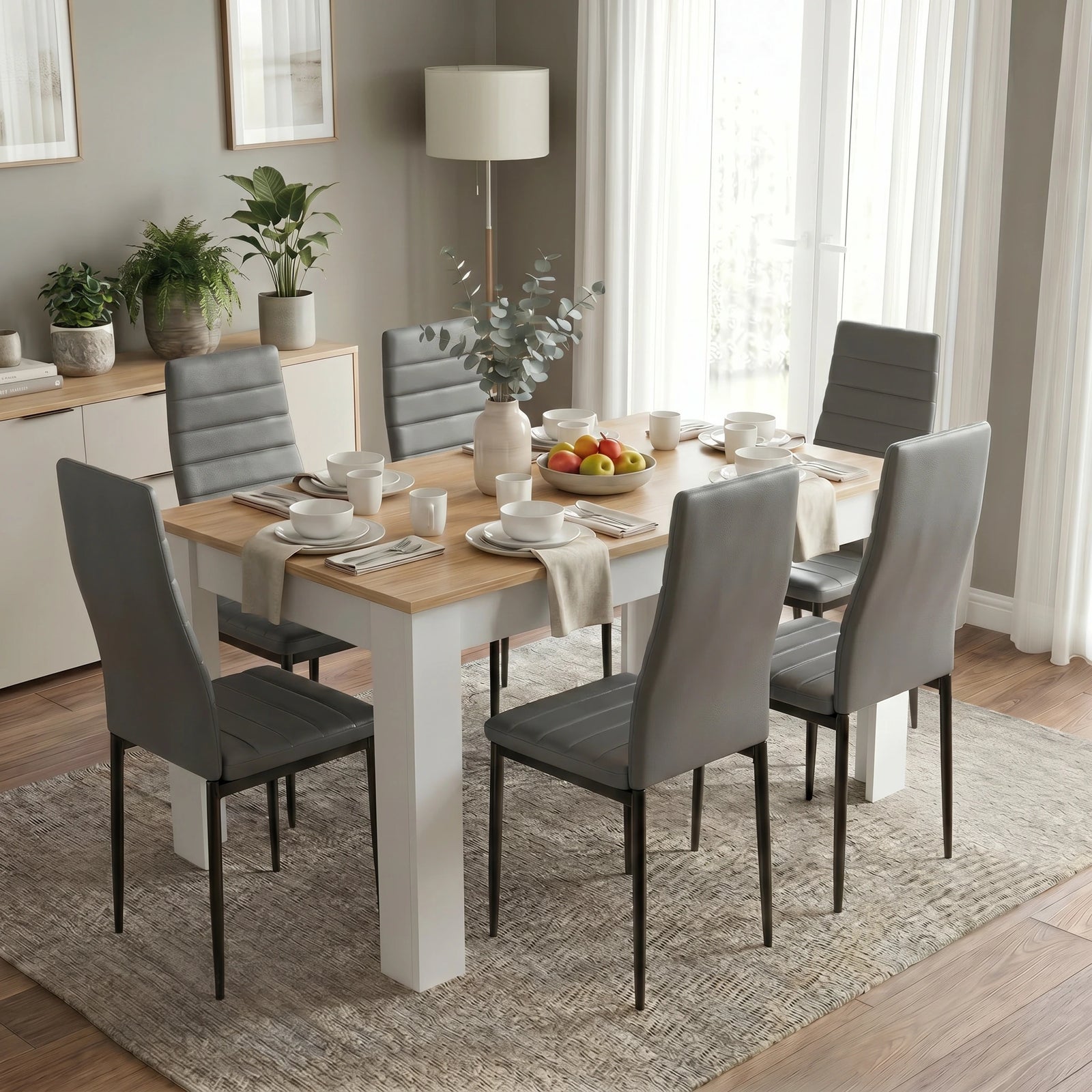 [6 Seater | Grey] White & Pine 4-6 Seater Dining Table and Chairs Set in an elevated side view showing six plates, individual cutlery settings, and a central fruit bowl
