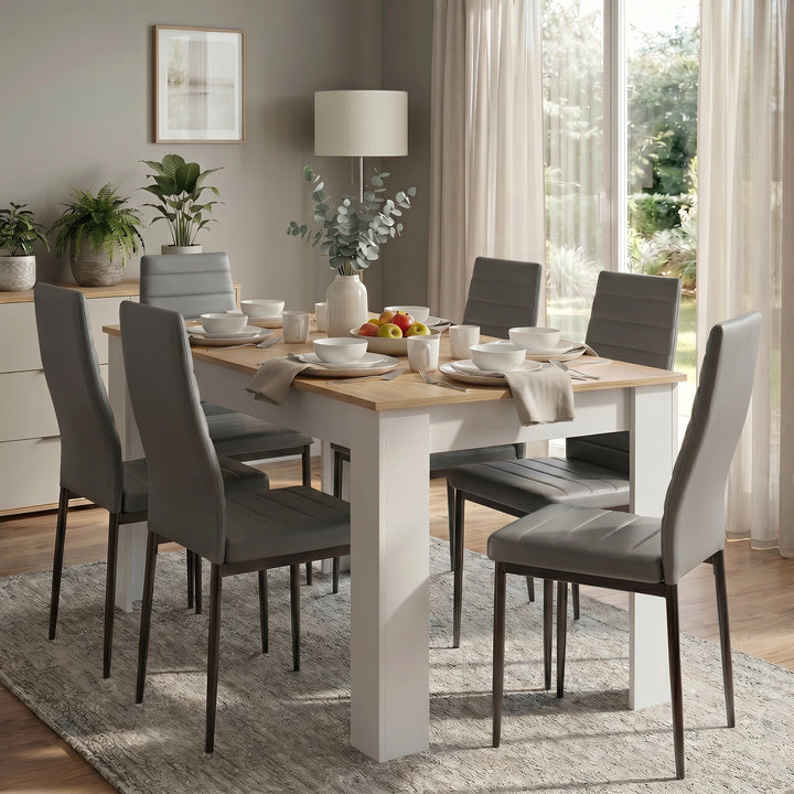 [6 Seater | Grey] White & Pine 4-6 Seater Dining Table and Chairs Set positioned next to a sunlit glass window in a contemporary home with neutral wall colors and houseplants
