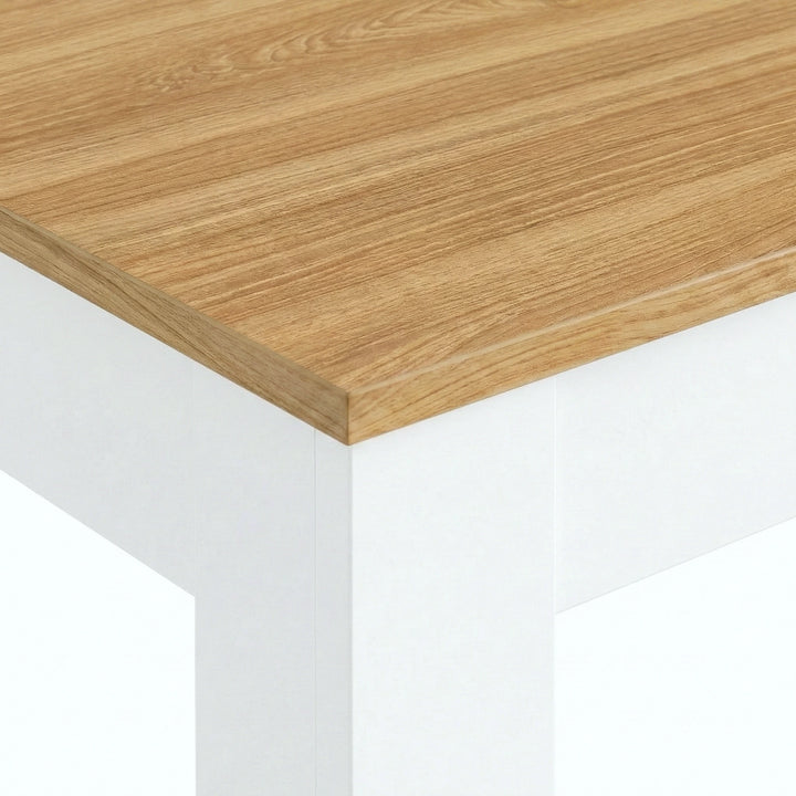 [4 Seater | White] Dining Table and Chairs Set close-up corner detail showing oak-effect pine tabletop surface texture and white painted table leg