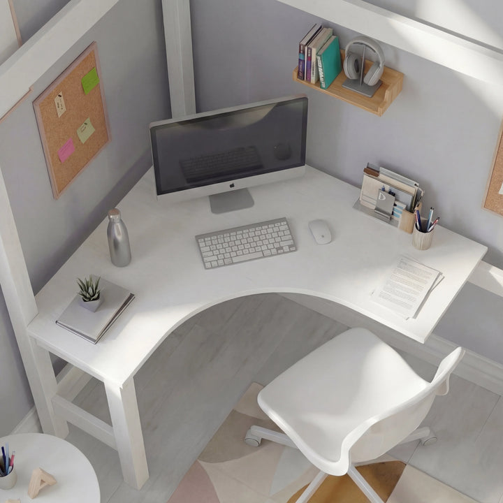[white + pine] bunk bed overhead view of built-in L-shaped corner desk with curved edge, computer setup and corkboard