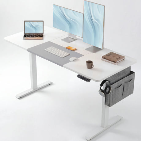 White Electric Standing Desk - Height Adjustable Office Desk with dual monitors, laptop, and accessories, ideal for ergonomic workspace setup.