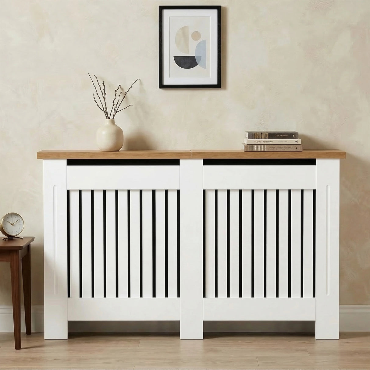 [Large | White] Radiator Cover with oak top shelf styled with a twig vase and stacked books against a warm neutral wall