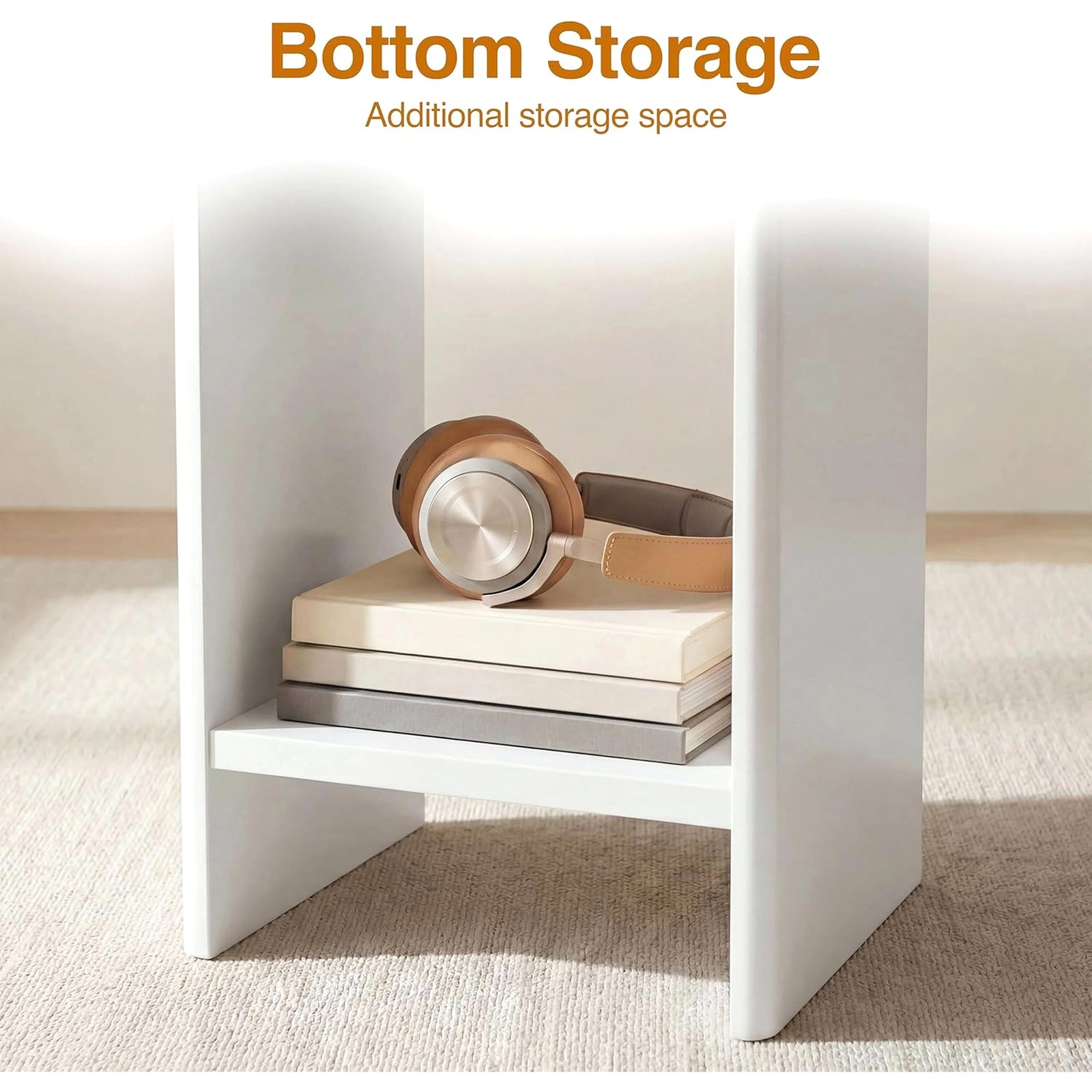 [White] Small Round Side Table with Shelf Living Room close-up of lower storage shelf between panel legs holding books and headphones on beige rug