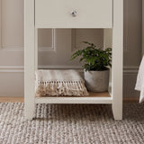 [White] Close-up detail of the polished silver round knob on the White Shaker Bedside Table drawer.