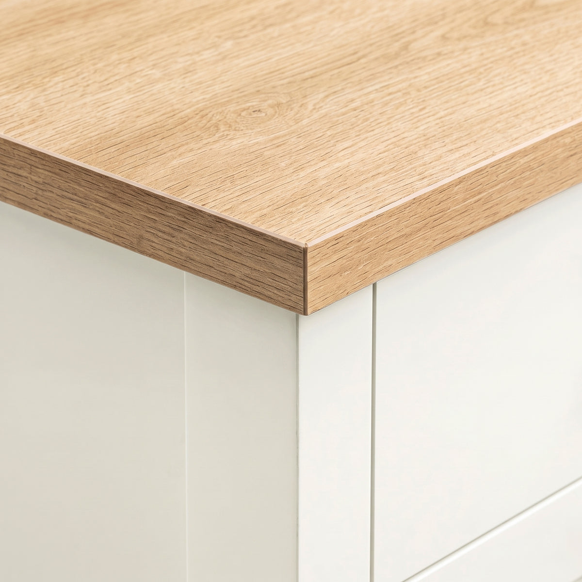 [White] Detail shot of the natural oak wood grain top edge on the White Shaker Bedside Table.