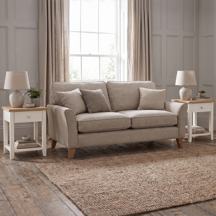 [White] White Shaker Bedside Table styled as a living room end table beside a neutral sofa.