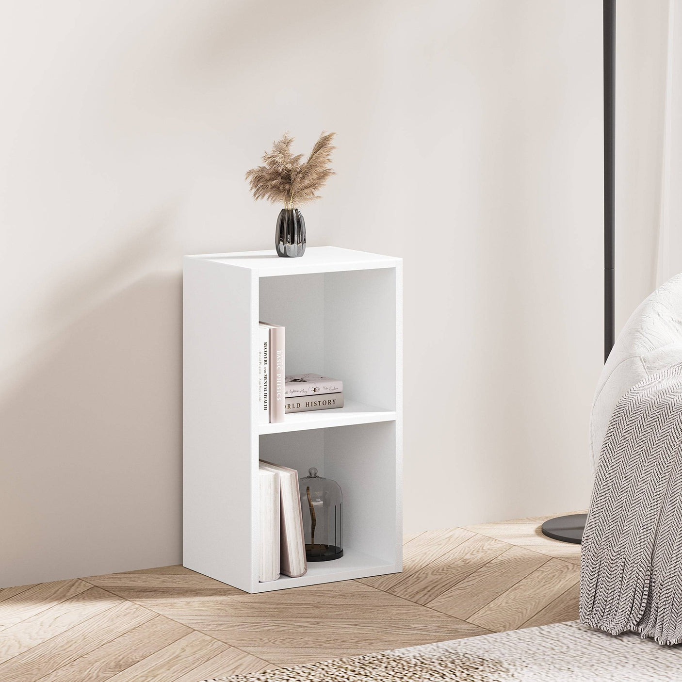 Minimalist white Blisswood 2 shelf bookcase used as a nightstand or side table in a cozy bedroom setup.