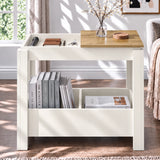 [White] Front view of an open side table compartment holding small items, with a blossom vase above and books underneath.