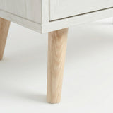 [White] Wovena Rattan 3 Door Sideboard - Adjustable Shelf White close-up detail of the splayed, tapered light wooden legs.