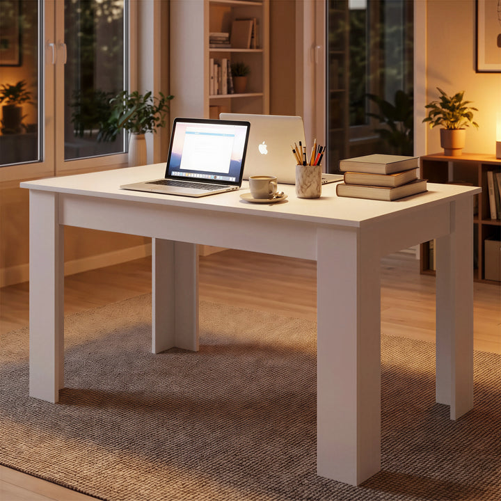 [140 cm | White] 6 Seater Dining Table Rectangle set up as a cozy study area at night with a laptop and books.
