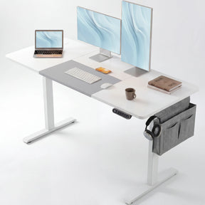 White Electric Standing Desk - Height Adjustable Office Desk with dual monitors, laptop, and accessories, ideal for modern workspaces.