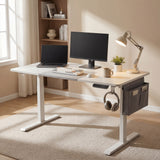 White Electric Standing Desk - Height Adjustable Office Desk with dual monitor setup, lamp, and side storage in modern home office.