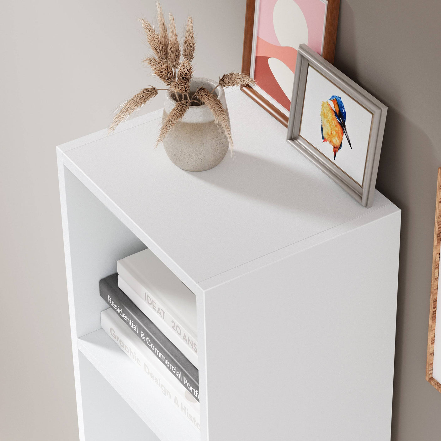 Top view of Blisswood white 2 shelf bookcase with decorative vase and framed art, ideal for modern interiors.