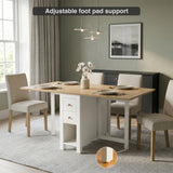 [White] Stovra Drop Leaf Dining Table fully extended in a dining room with adjustable foot pad detail callout