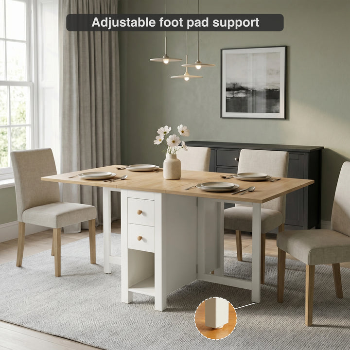 [White] Stovra Drop Leaf Dining Table fully extended in a dining room with adjustable foot pad detail callout