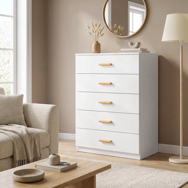[White] Wide lifestyle view of the White Tall 5 Drawer Chest styled in a modern neutral living space.