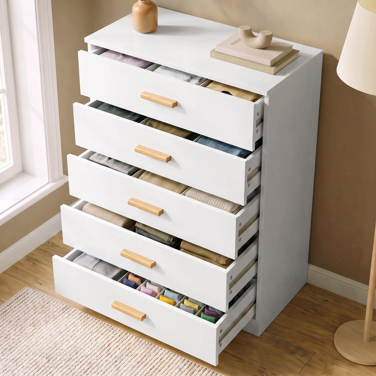 [White] High-angle view of the White Tall 5 Drawer Chest with all five drawers pulled open showing storage space.