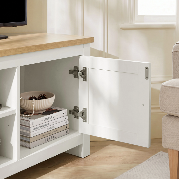 [White] Tavero corner TV unit cabinet door open showing interior storage space and silver hinge