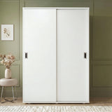 [White] Torvek large sliding wardrobe fully closed front view in neutral bedroom with chrome recessed handles
