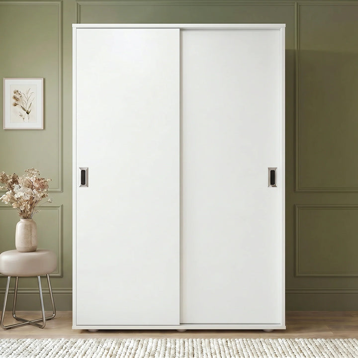 [White] Torvek large sliding wardrobe fully closed front view in neutral bedroom with chrome recessed handles