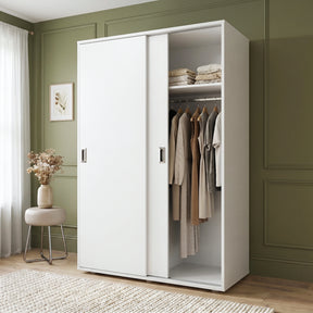 [White] Torvek large sliding wardrobe side angled view in bright neutral bedroom with sheer curtains