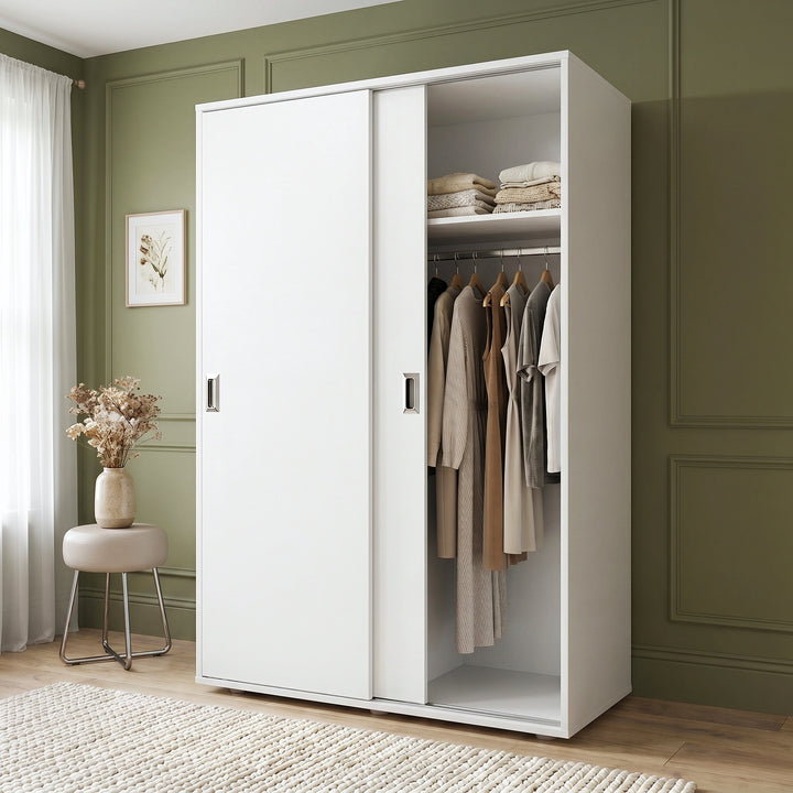 [White] Torvek large sliding wardrobe side angled view in bright neutral bedroom with sheer curtains