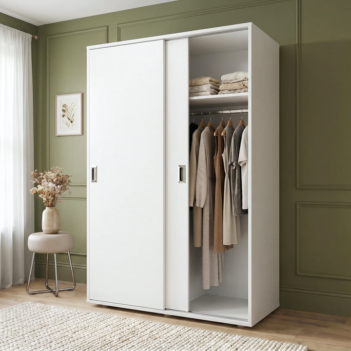 [White] Torvek large sliding wardrobe side angled view in bright neutral bedroom with sheer curtains