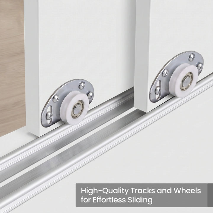 [White] Torvek wardrobe close-up of white sliding door roller wheels on aluminium bottom track rail