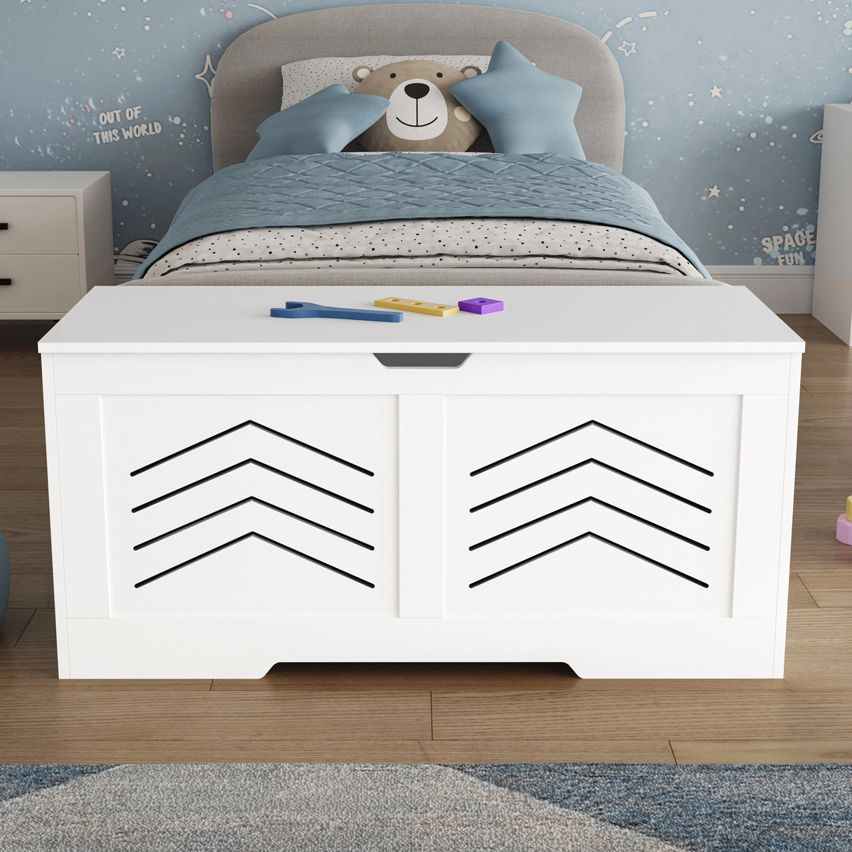 Toy Storage Box - Kids Storage Chest Blanket Box with Safety Hinges in white with arrow design, placed in a child's bedroom with blue decor.