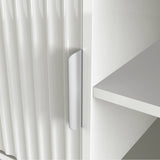 White TV cabinet with open center shelving, fluted side doors, and a sleek silver handle for an organized, modern living room