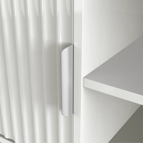 White TV cabinet with open center shelving, fluted side doors, and a sleek silver handle for an organized, modern living room