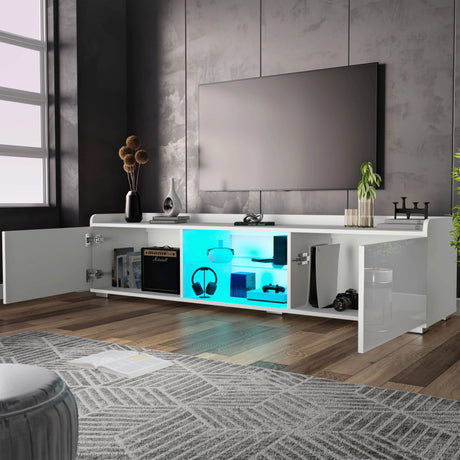 Modern living room with a white entertainment console, TV, and decorative items.