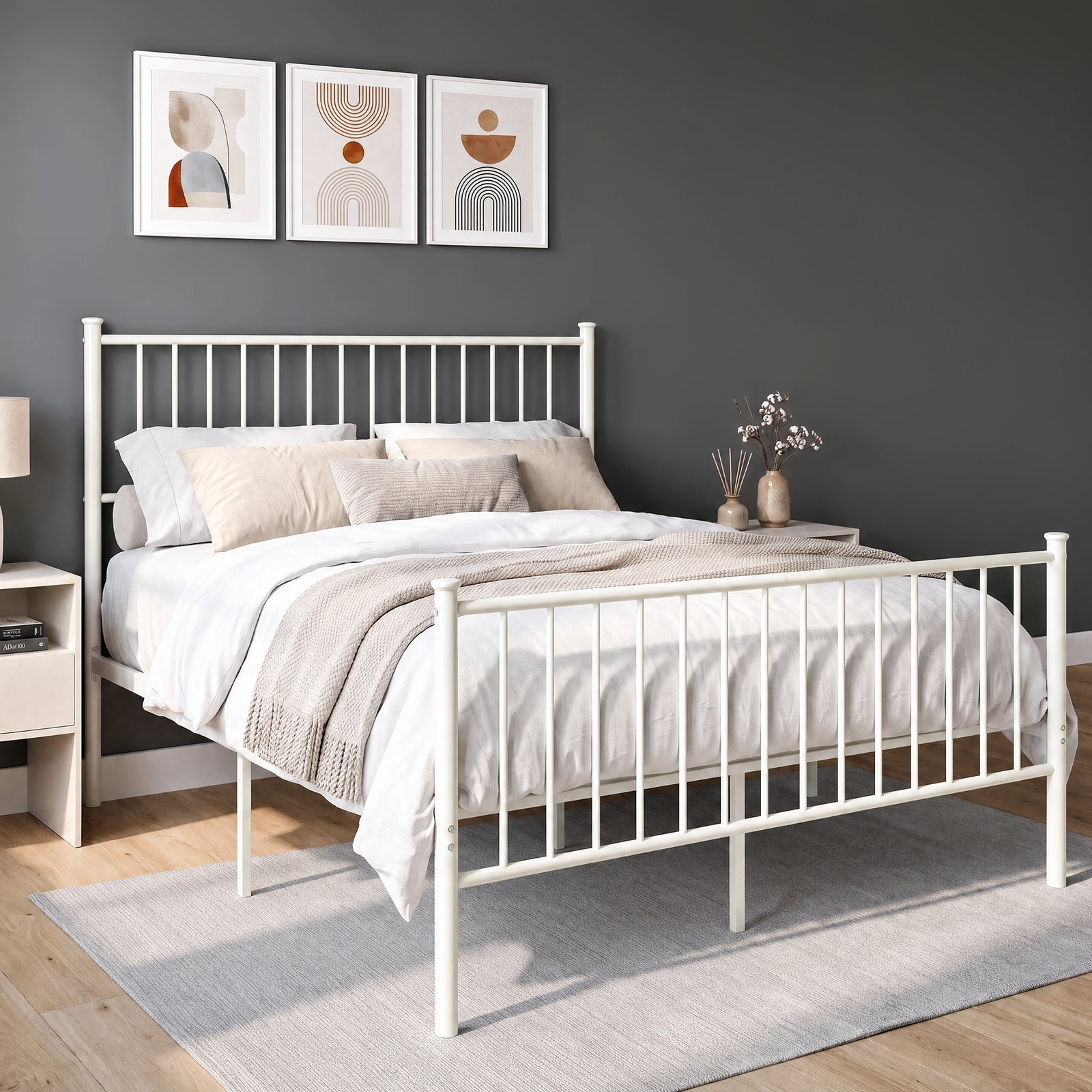 [White | Double] Angled view of white metal bed with bedding, tall bar headboard, matching footboard and centre support legs.