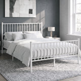 [White | King] Angled view of metal bed with white bedding, bar ends, centre legs, bedside lamps, wall art and bright window.