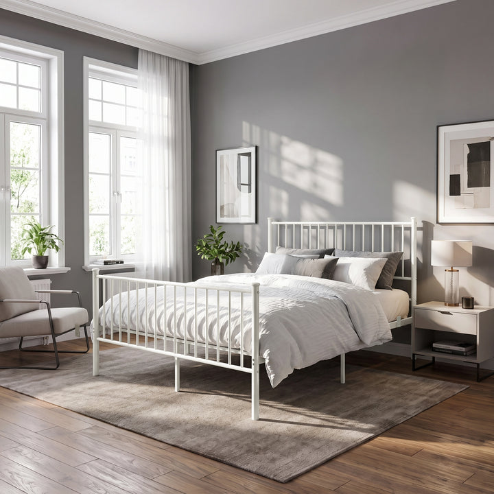 [White | King] White metal king bed with white-grey bedding, bar headboard and footboard, centre legs, chair, plants and lamp
