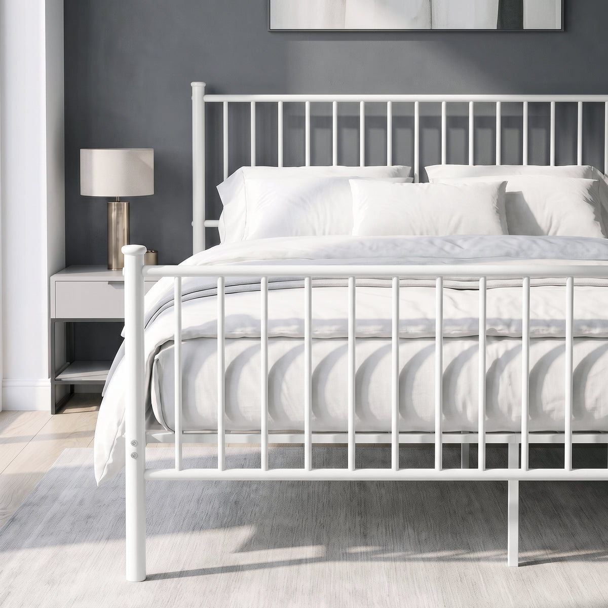 [White | King] Metal bed front close-up view of bar headboard and footboard, white bedding, centre legs, bedside table & lamp