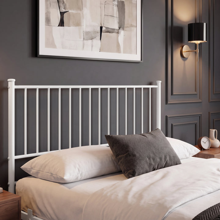 [White | Double] High headboard detail of white vertical metal double bed frame with neutral bedding.