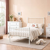 [White | Single] Metal bed styled with white bedding, flower cushion, beige throw, dresser, teddy, doll and string lights.