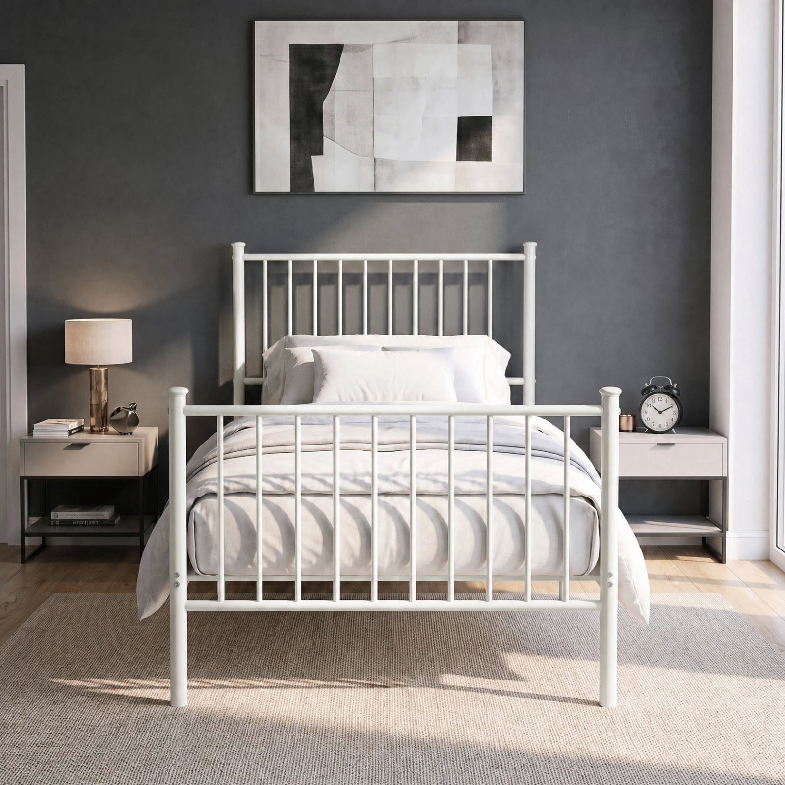 [White | Single] Front view of vertical iron bed with white-grey bedding, bar ends, centre leg, wall art, lamp & alarm clock.