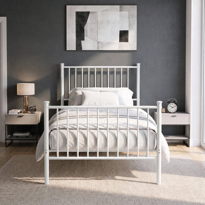 [White | Single] Front view of vertical iron bed with white-grey bedding, bar ends, centre leg, wall art, lamp & alarm clock.