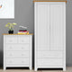 White wardrobe and chest of drawers with silver handles, minimalist design.