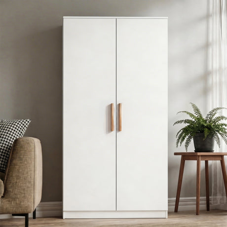 [White] wardrobe with wooden handles in a room with a chair, pillow, and plant.