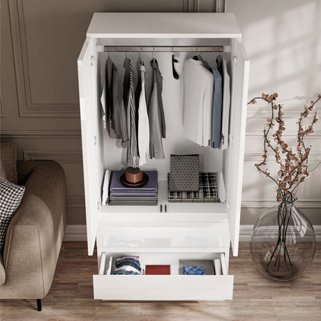 [White] open wardrobe from 3 piece set showing full-width hanging rail with clothes and bottom drawer