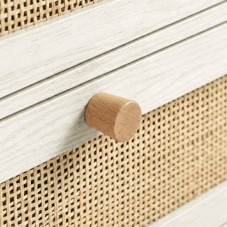[White] Wovena chest close-up detail showing rounded solid wood knob against rattan weave drawer front panel